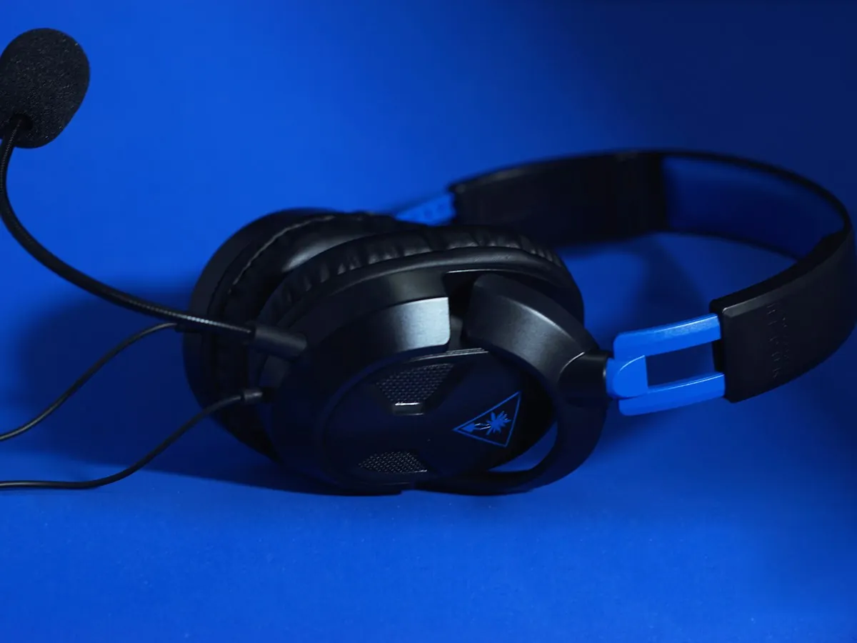 Gaming headset with a microphone on a blue background.